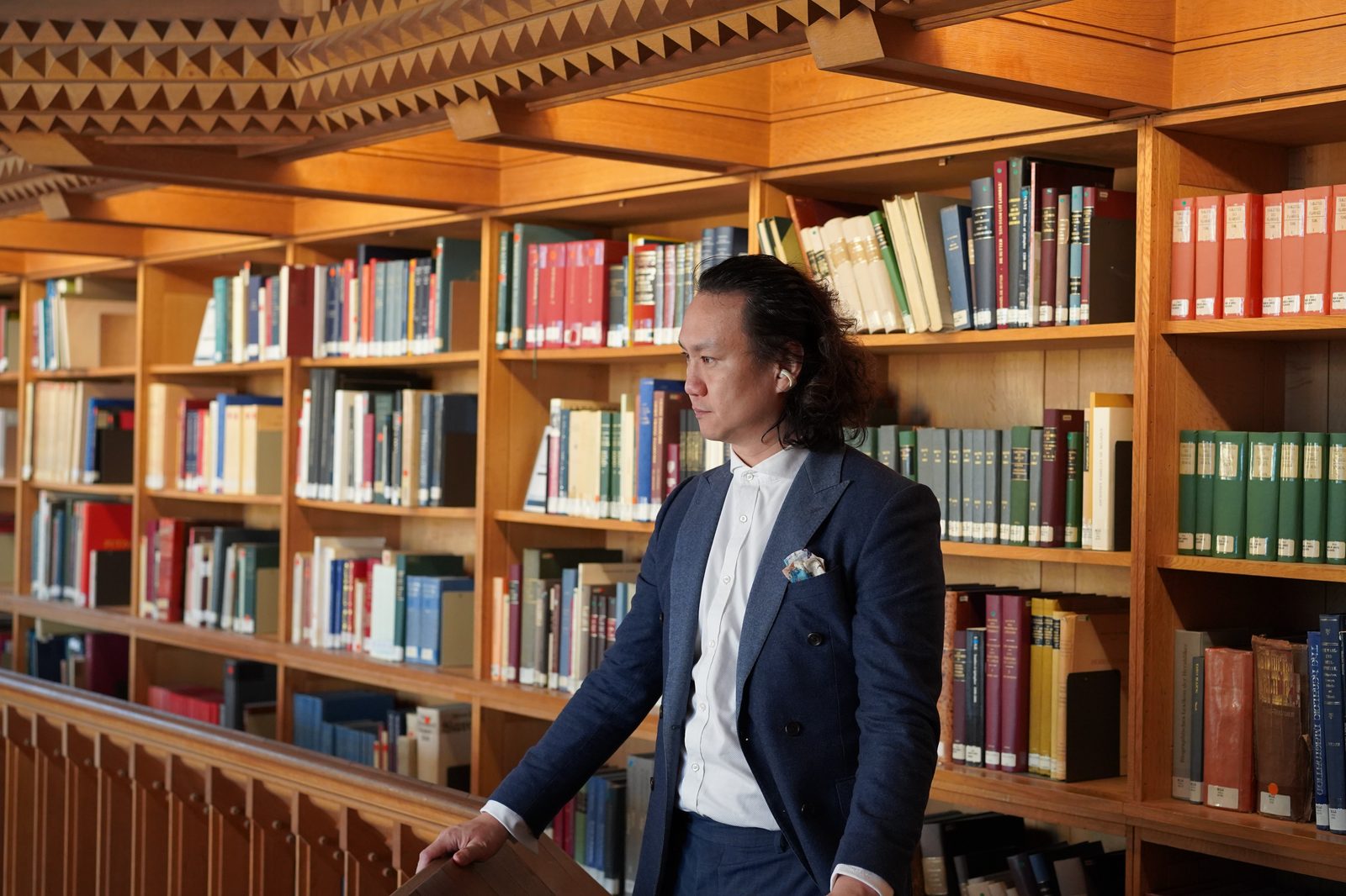 James Liu working in a Luxembourg library