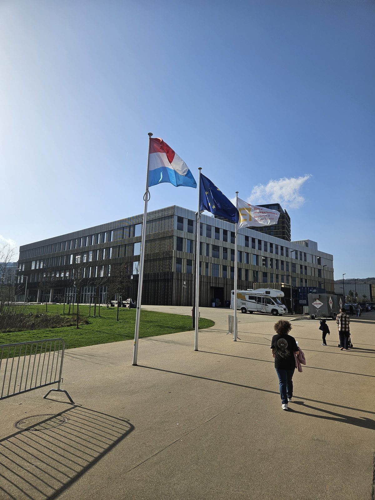 International school campus in Luxembourg with Luxembourg and EU flags