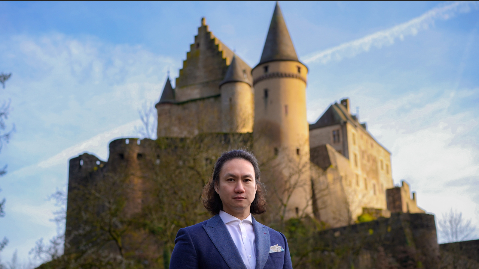 James Liu with a castle in the background